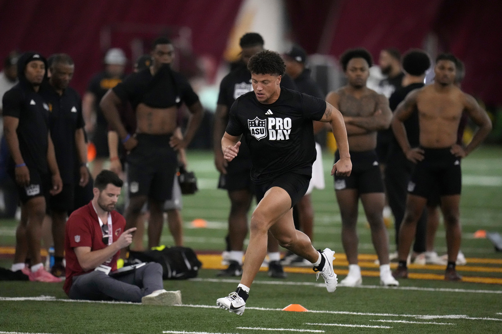 Arizona State linebacker Keyshaun Elliott runs an agility drill during the school's NFL football Pro Day, Friday, March 27, 2026, in Tempe, Ariz. (AP Photo/Ross D. Franklin)