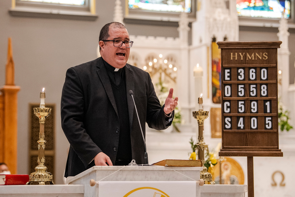 FILE - Rev. Manuel Rodriguez celebrates Mass at Our Lady of Sorrows Catholic Church in the Queens borough of New York, on Sunday, May 8, 2022. (AP Photo/Brittainy Newman, File)
