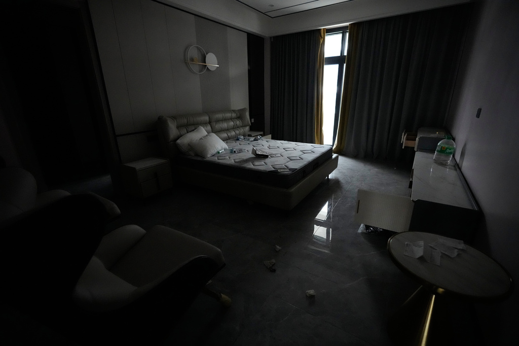 A bedroom sits empty at one of the residences at the sprawling former Baofu scam compound that was raided by authorities last year in Bamban, Tarlac city, northern Philippines, Thursday, June 5, 2025. (AP Photo/Aaron Favila)