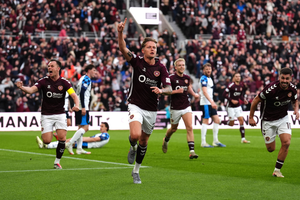 Heart of Midlothian's Frankie Kent, center, celebrates scoring their first goal of the game during the Scottish Premiership soccer match between Heart of Midlothian and Falkirk, Wednesday, May 13, 2026, in Edinburgh, Scotland. (Andrew Milligan/PA via AP)