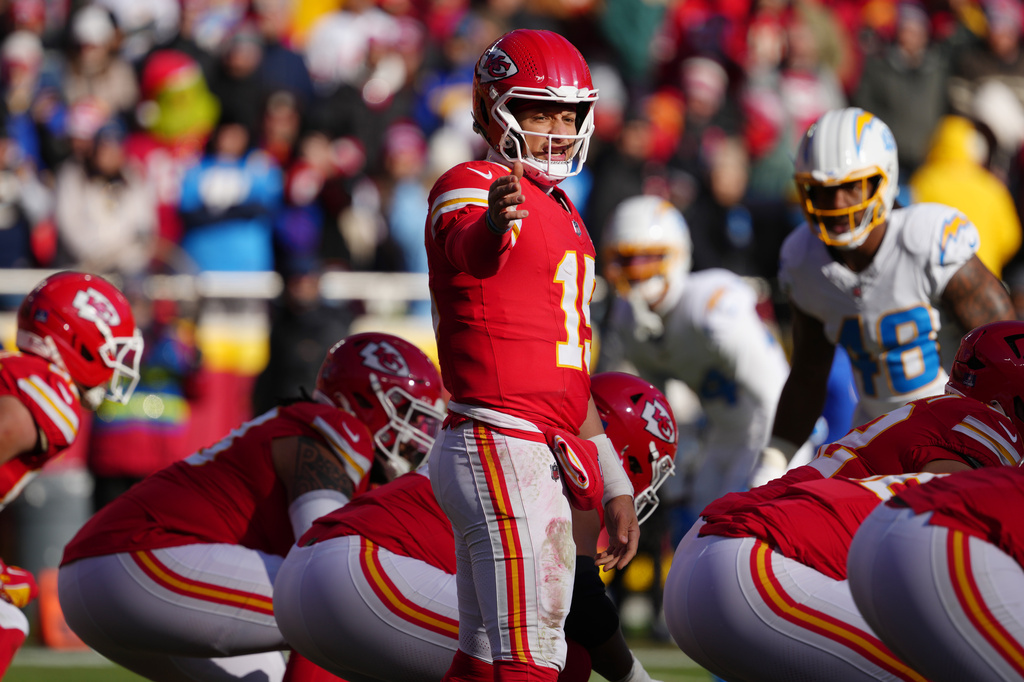 FILE - Kansas City Chiefs quarterback Patrick Mahomes directs his team against the Los Angeles Chargers during an NFL football game, Dec, 14, 2025, in Kansas City, Mo. (AP Photo/Ed Zurga, File)