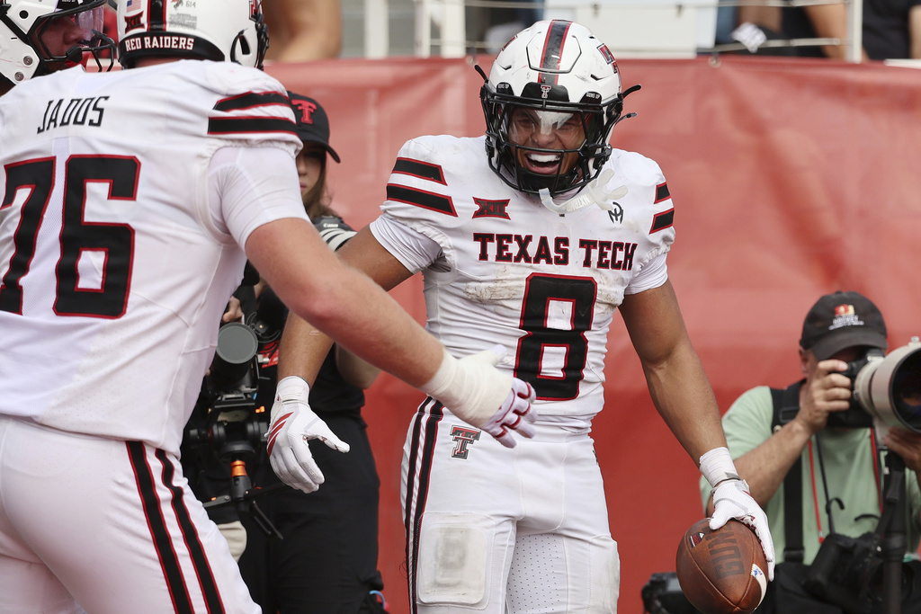 Texas Tech running back Cameron Dickey celebrates a touchdown against Utah during the second half of an NCAA college football game Saturday, Sept. 20, 2025, in Salt Lake City, Utah. (AP Photo/Jeffrey D. Allred)