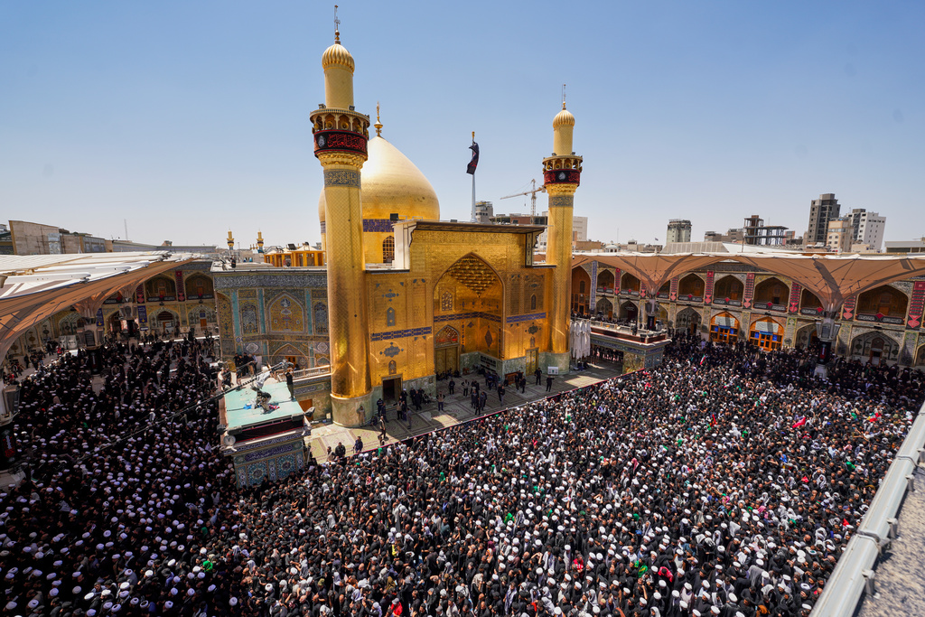 Mourners gather in prayer during the funeral procession for the late Iranian Supreme Leader Ayatollah Ali Khamenei inside the Imam Ali Shrine in Najaf, Iraq, Wednesday, July 8, 2026. (AP Photo/Anmar Khalil)