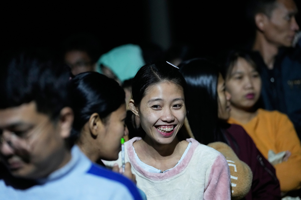 Voters wait for a polling station to open in Naypyitaw, Myanmar, Sunday, Dec. 28, 2025. (AP Photo/Aung Shine Oo)