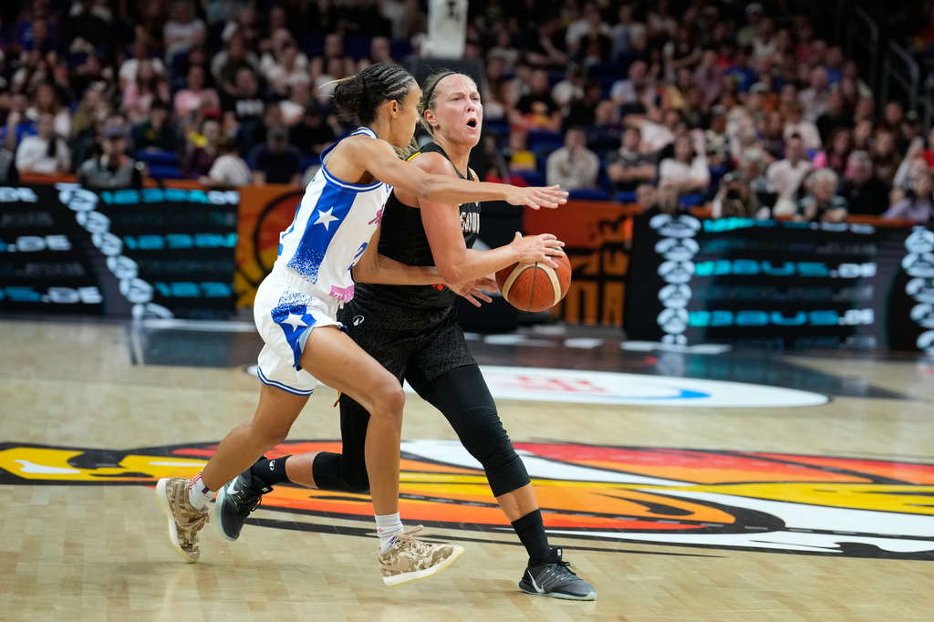 Puerto Rico's Trinity San Antonio guards Belgium's Julie Allemand during the Women's Basketball World Cup match between Puerto Rico and Belgium in Berlin, Sunday, Sept. 6, 2026. (AP Photo/Ebrahim Noroozi)