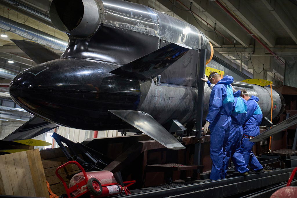 FILE - Workers inspect a Flamingo cruise missile at Fire Point's secret factory in Ukraine on Monday, Aug. 18, 2025. (AP Photo/Efrem Lukatsky, File)