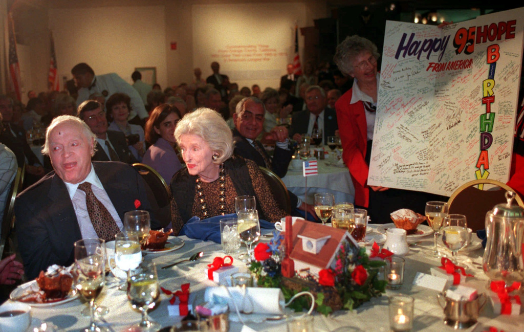 FILE - Comedian Bob Hope and his wife Dolores react to a birthday card presented to Hope Monday, April 20, 1998, at the Nixon Library and birthplace in Yorba Linda, Calif. (AP Photo/John Hayes, File)