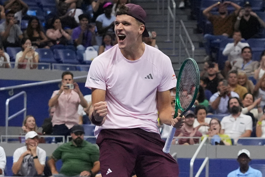 Jakub Mensik, of the Czech Republic, celebrates after he and Karolina Muchova, of the Czech Republic, defeated Belinda Bencic, of Switzerland, and Flavio Cobolli, of Italy, in the mixed doubles final match at the U.S. Open tennis championships Wednesday, Aug. 26, 2026, in New York. (AP Photo/Frank Franklin II)