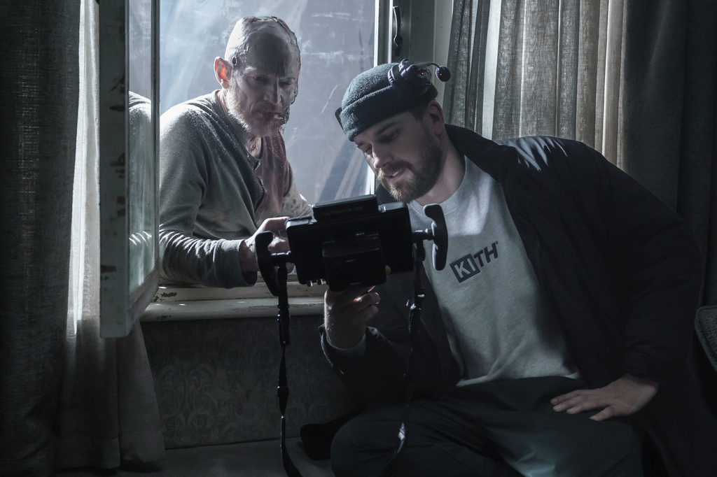 This image released by Warner Bros. Pictures shows actor Erroll Shand, left, with director Sébastien Vanicek on the set of "Evil Dead Burn." (Warner Bros. Pictures via AP)