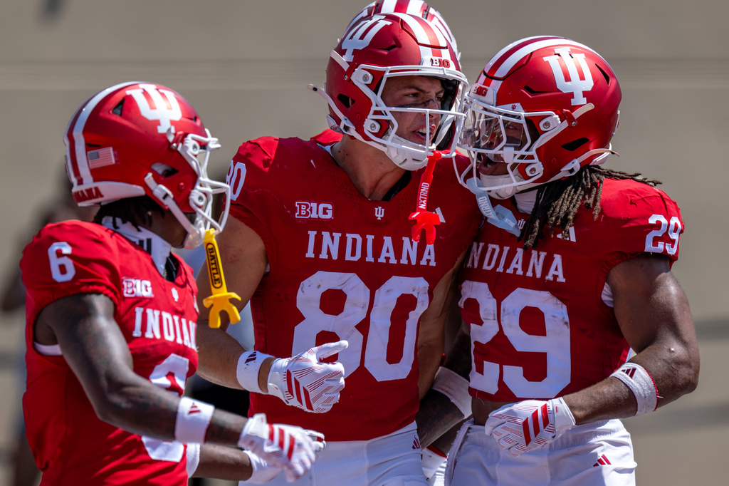 Indiana wide receiver Charlie Becker (80) celebrates with teammates after scoring a touchdown during the second half of an NCAA college football game against North Texas, Saturday, Sept. 5, 2026, in Bloomington, Ind. (AP Photo/Doug McSchooler)