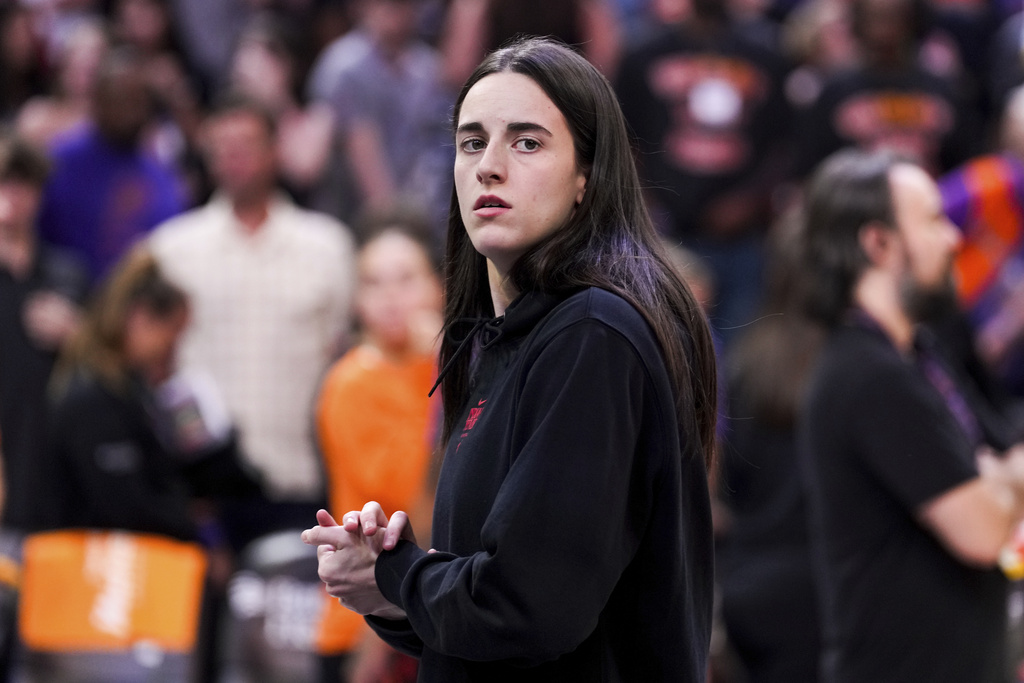 Indiana Fever guard Caitlin Clark walks off the court after a WNBA basketball game against the Phoenix Mercury, Tuesday, Sept. 2, 2025, in Phoenix. (AP Photo/Samantha Chow)