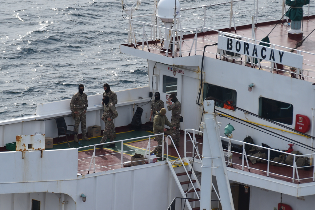 Soldiers stand on the deck on the tanker Boracay that allegedly belongs to Russia's so-called shadow fleet, Thursday, Oct. 2, 2025, off Saint-Nazaire, France's Atlantic coast. (AP Photo/Mathieu Pattier)