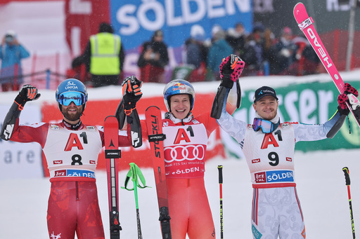 Switzerland's Marco Odermatt, center, winner of an alpine ski, men's World Cup giant slalom, celebrates with second-placed Austria's Marco Schwarz, left, and third-placed Norway's Atle Lie McGrath, in Soelden, Austria, Sunday, Oct. 26, 2025. (AP Photo/Marco Trovati) Switzerland's Marco Odermatt, center, winner of an alpine ski, men's World Cup giant slalom, celebrates with second-placed Austria's Marco Schwarz, left, and third-placed Norway's Atle Lie McGrath, in Soelden, Austria, Sunday, Oct. 26, 2025. (AP Photo/Marco Trovati)