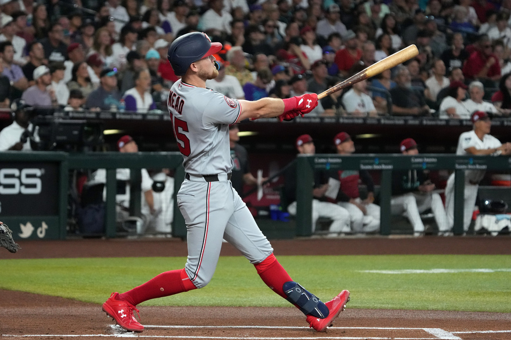 Washington Nationals' Curtis Mead hits a two-run home run against the Arizona Diamondbacks in the first inning of a baseball game, Saturday, June 6, 2026, in Phoenix. (AP Photo/Rick Scuteri)
