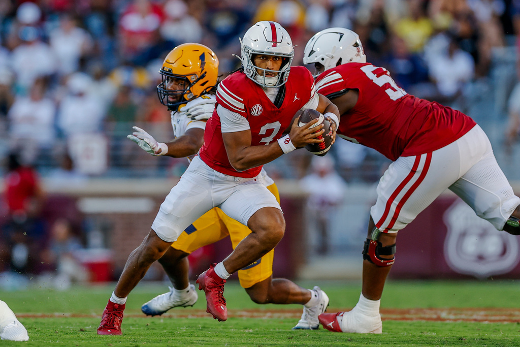 Oklahoma quarterback Michael Hawkins Jr. (3) runs for a first down against Kent State during the second half of an NCAA college football game Saturday, Oct. 4, 2025, in Norman, Okla. (AP Photo/Alonzo Adams)