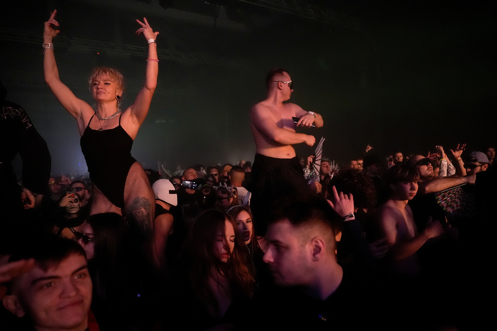 People dance during a Halloween rave in Kyiv, Ukraine, Saturday, Oct. 25, 2025. (AP Photo/Julia Demaree Nikhinson)