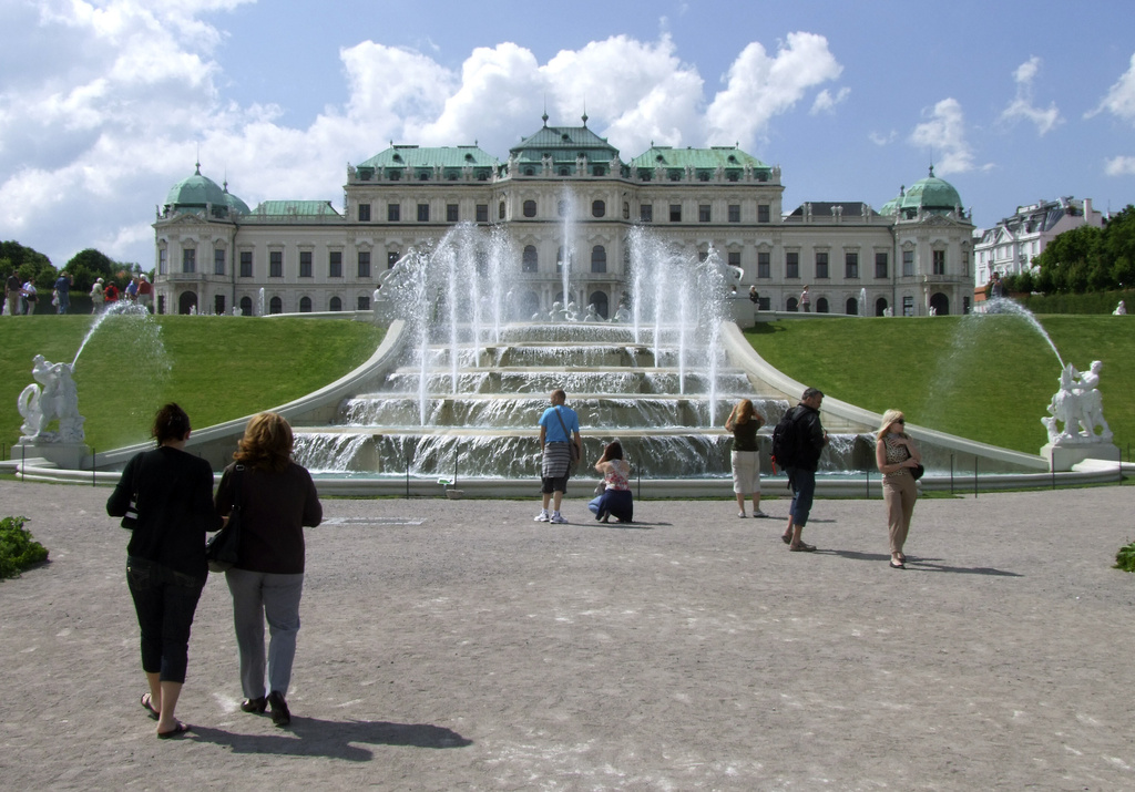 FILE - Tourists enjoy the sunny weather in front of Vienna's Belvedere Palace Austria, on Thursday, June 24, 2010. (AP Photo/Hans Punz, File)