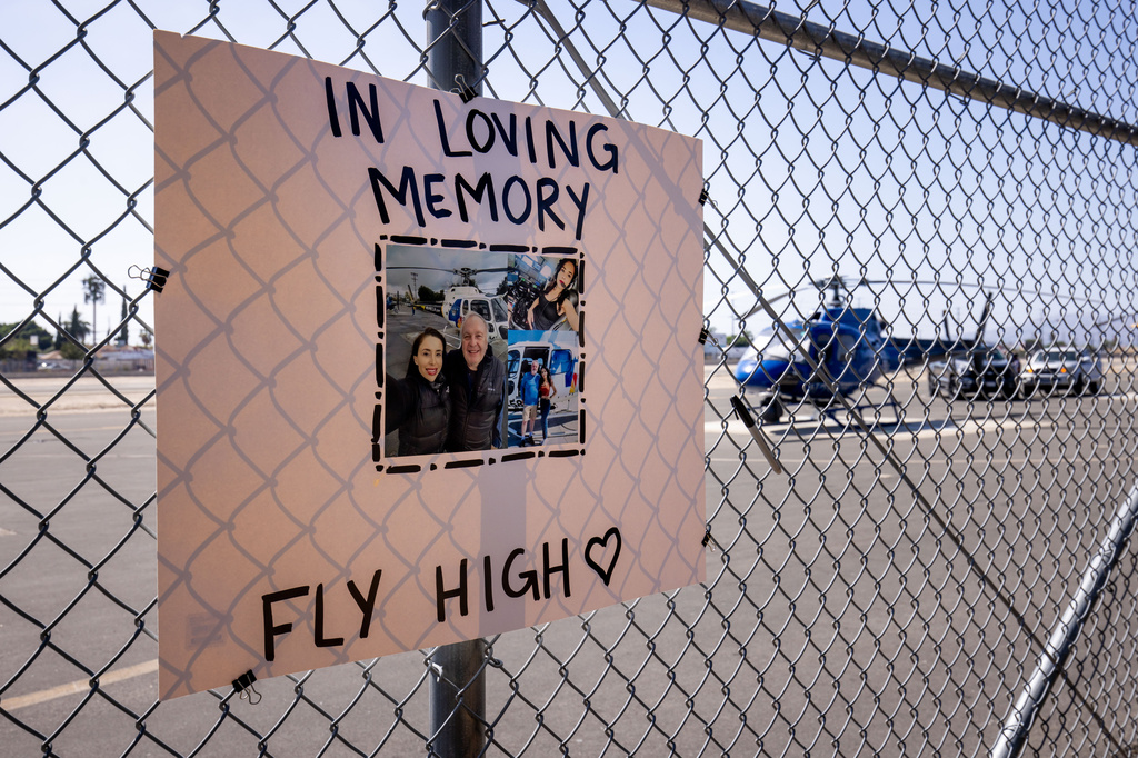 A memorial for Eliana Moreno and George Marciniw, who died in a helicopter crash the day prior while covering an accident for a television station, stands at the site where their helicopter used to park at Whiteman Airport in Los Angeles, Wednesday, Sept. 16, 2026. (AP Photo/Ethan Swope) ADDITION: the day prior while covering an accident for a television station.