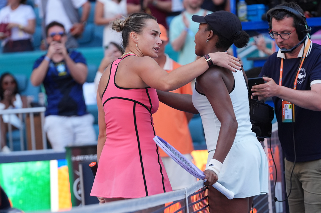 Aryna Sabalenka, left, and Coco Gauff embrace at the end of the women's singles final at the Miami Open tennis tournament, Saturday, March 28, 2026, in Miami Gardens, Fla. (AP Photo/Marta Lavandier)