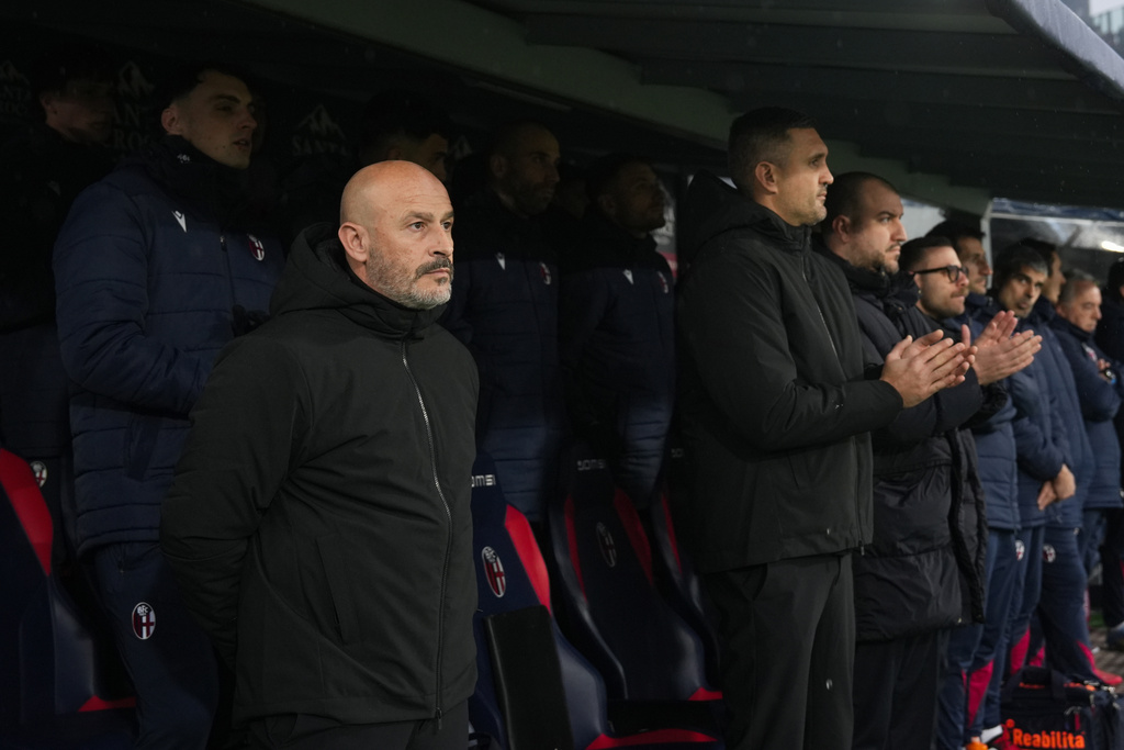 Bologna's head coach Vincenzo Italiano looks during a minute of silence to honor late Fiorentina President Rocco Commisso during the Serie A soccer match between Bologna and Fiorentina, in Bologna, Italy, Sunday, Jan. 18, 2026. (Massimo Paolone/LaPresse via AP)