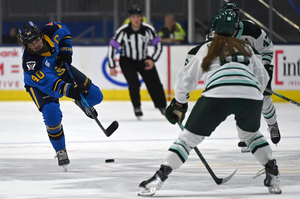 Toronto Sceptres' forward Blayre Turnbull (40) shoots the puck into the Boston Fleet zone during second period of an PWHL hockey game against the Toronto Sceptres in Toronto on Friday, March 27, 2026. (Jon Blacker/The Canadian Press via AP)
