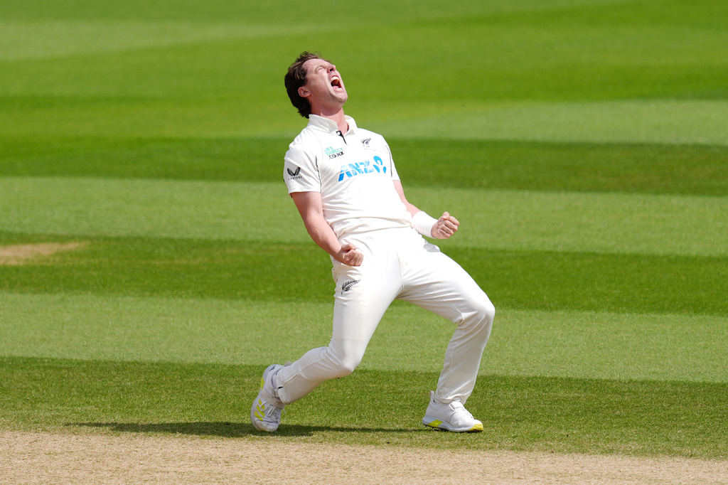 New Zealand's Matt Henry celebrates taking the wicket of England's Joe Root on day five of the Second Rothesay Test cricket match between England and New Zealand in London, England, Sunday, June 21, 2026. (Ben Whitley/PA via AP