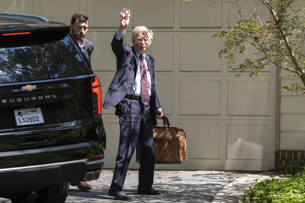 Former national security adviser John Bolton arrives at his house Friday, Aug. 22, 2025, in Bethesda, Md. (AP Photo/Manuel Balce Ceneta)