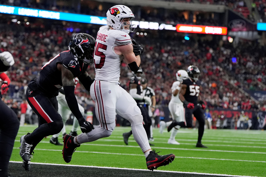 Arizona Cardinals tight end Trey McBride, right, makes a touchdown catch against Houston Texans linebacker Damone Clark, left, during the first half of an NFL football game Sunday, Dec. 14, 2025, in Houston. (AP Photo/Ashley Landis)