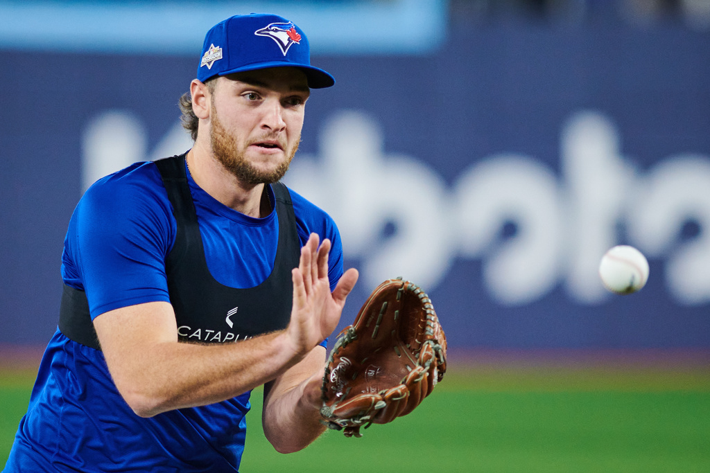 Toronto Blue Jays pitcher Trey Yesavage practices with his team ahead of Game 1 of baseball's American League Championship Series against the Seattle Mariners in Toronto, Saturday, Oct. 11, 2025. (Sammy Kogan/The Canadian Press via AP)