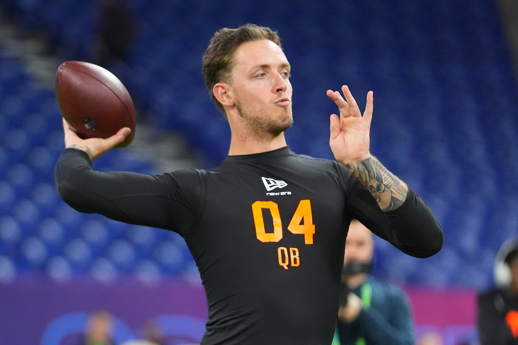 FILE - Miami quarterback Carson Beck (04) runs a drill at the NFL football scouting combine in Indianapolis, Feb. 28, 2026. (AP Photo/Julio Cortez, File)