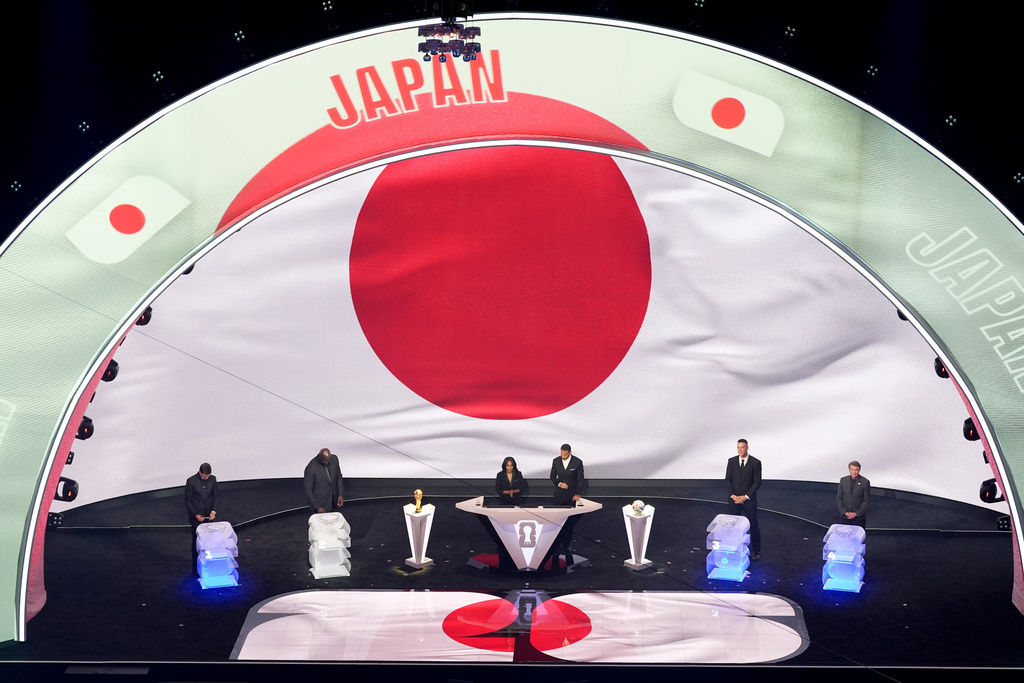 From left; former NFL player Tom Brady, former NBA player Shaquille O'Neal, broadcaster Samantha Johnson, former England soccer captain Rio Ferdinand, New York Yankees' Aaron Judge and former NHL player Wayne Gretzky participate in the draw for the 2026 soccer World Cup at the Kennedy Center in Washington, Friday, Dec. 5, 2025. (AP Photo/Alex Brandon)