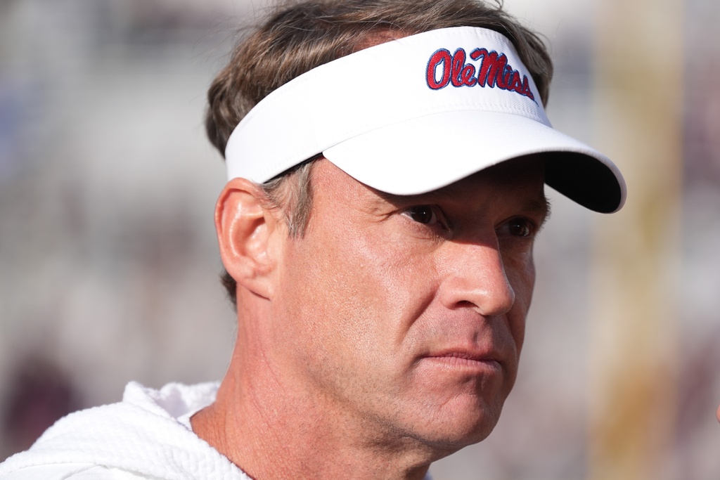 Mississippi head coach Lane Kiffin looks out over the playing field following his team's win over Mississippi State in their annual NCAA college football game, Friday, Nov. 28, 2025, in Starkville, Miss. (AP Photo/Rogelio V. Solis)