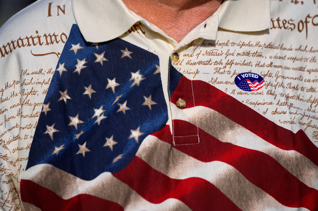 FILE - A man wears an "I voted" sticker on his shirt, printed with the American flag and the U.S. constitution, after voting at Wa-Ke Hatchee Recreation Center in Fort Myers, Fla, on Election Day, Nov. 8, 2022. (AP Photo/Rebecca Blackwell, File)