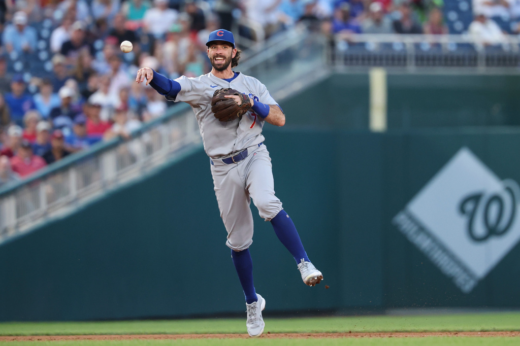 Chicago Cubs shortstop Dansby Swanson throws to first base for an out on a ball hit by Washington Nationals' Dylan Crews during the third inning of a baseball game, Tuesday, Aug 11, 2026, in Washington. (AP Photo/Terrance Williams)