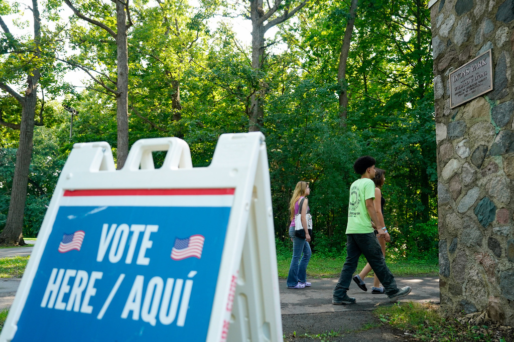 FILE - Voters arrive to cast their ballots at Lyons Park on primary Election Day, Aug. 11, 2026, in Milwaukee. (AP Photo/Kayla Wolf, File)