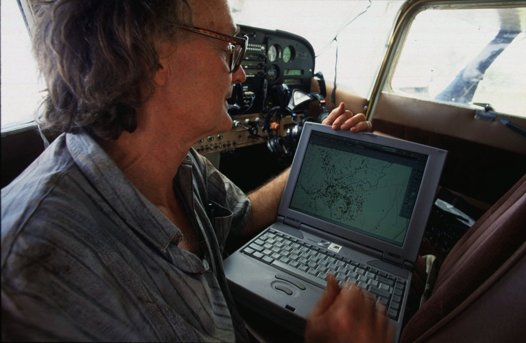 FILE - Dr. Iain Douglas-Hamilton checks on his laptop computer the position of an elephant fitted with a Global Positioning System (GPS) beacon in the Meru National Park, Kenya, May 21, 1998. (AP Photo/Jean-Marc Bouju, File)