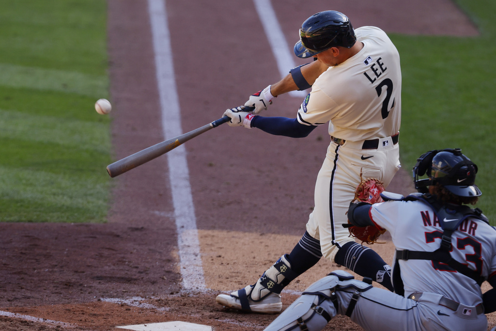 Minnesota Twins' Brooks Lee hits a two run home run against the Cleveland Guardians in the sixth inning of a baseball game Sunday, Sept. 21, 2025, in Minneapolis. (AP Photo/Bruce Kluckhohn)
