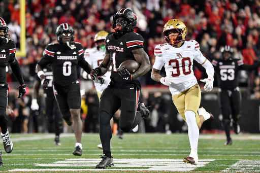 Louisville running back Isaac Brown (1) is pursued by Boston College defensive back TJ Green (30) during the first half of an NCAA college football game in Louisville, Ky., Saturday, Oct. 25, 2025. (AP Photo/Timothy D. Easley) Louisville running back Isaac Brown (1) is pursued by Boston College defensive back TJ Green (30) during the first half of an NCAA college football game in Louisville, Ky., Saturday, Oct. 25, 2025. (AP Photo/Timothy D. Easley)