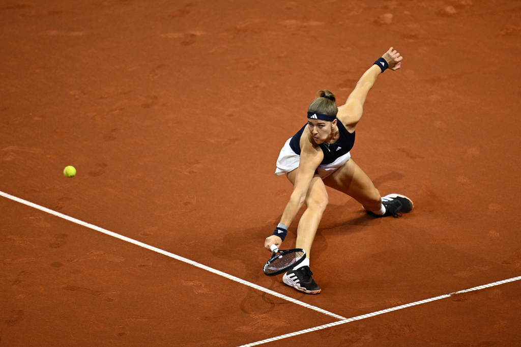 Czech Republic's Karolina Muchova returns a shot to Kazakhstan's Elena Rybakina, during the women's final match at the Stuttgart Open tennis tournament, in Stuttgart, Germany, Sunday, April 19, 2026. (Marijan Murat/dpa via AP) CORRECTION:name corrected to Elena instead of Jelena