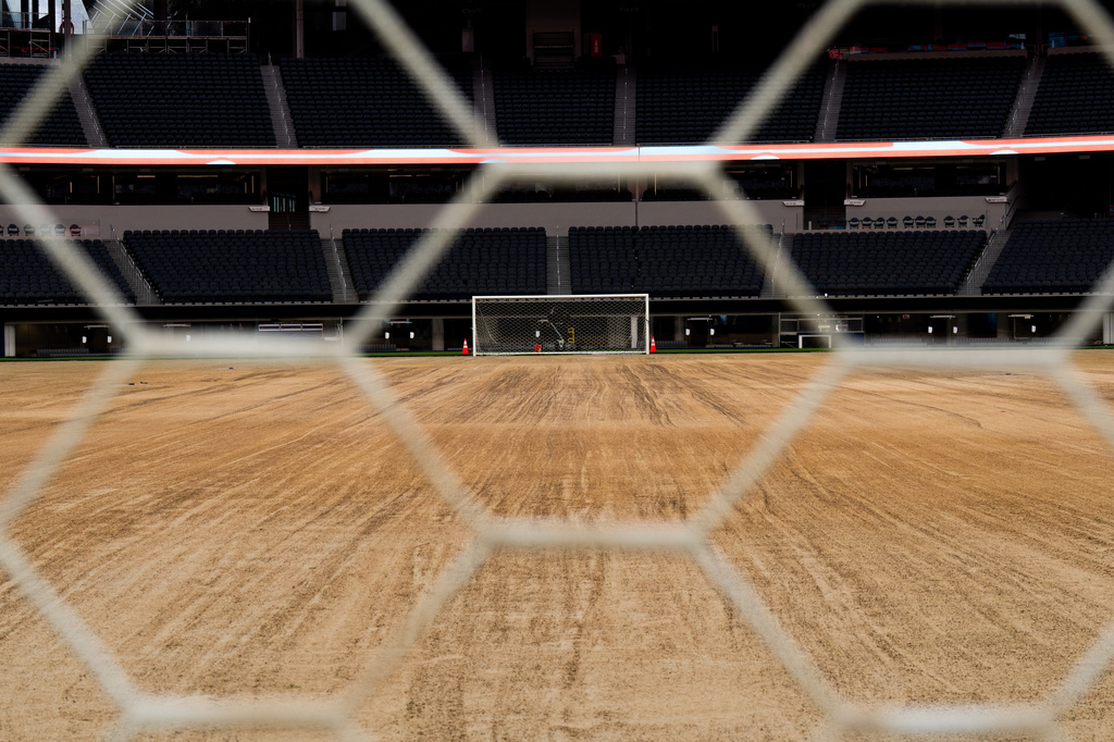 A view through a goal net shows the field at SoFi Stadium in Inglewood, Calif., Tuesday, May 12, 2026, during a media event for the upcoming FIFA World Cup soccer tournament.. (AP Photo/Jae C. Hong)