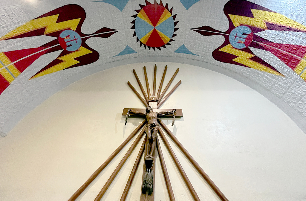 Native American imagery is displayed on the ceiling of the St. Stephens Indian Mission Catholic church in Arapahoe, Wyo., on Monday, Aug. 17, 2026. (AP Photo/Thomas Peipert)