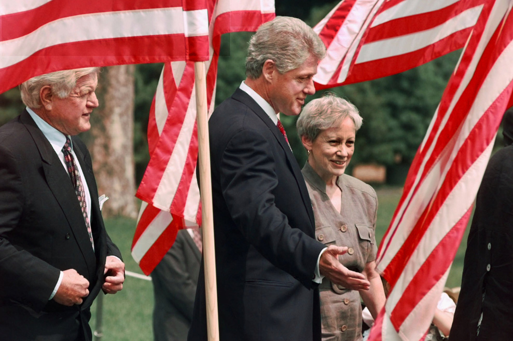 FILE - President Bill Clinton, flanked by Sen. Nancy Kassebaum, R-Kansas, right, and Sen. Edward Kennedy, D-Mass., arrives on the South Lawn of the White House, Aug. 21, 1996, prior to signing the Health Insurance Portability and Accountability Act. (AP Photo/Ruth Fremson, File)