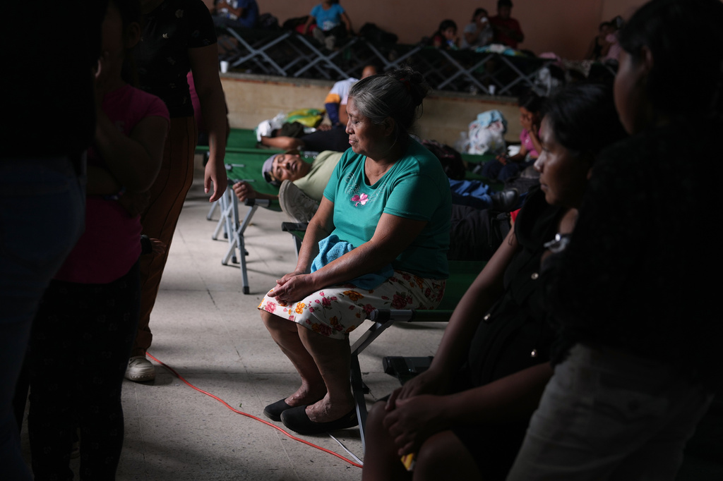 Residents evacuated from areas surrounding the Fuego volcano rest in a temporary shelter in San Juan Alotenango, Guatemala, Tuesday, Aug. 4, 2026. (AP Photo/Moises Castillo)