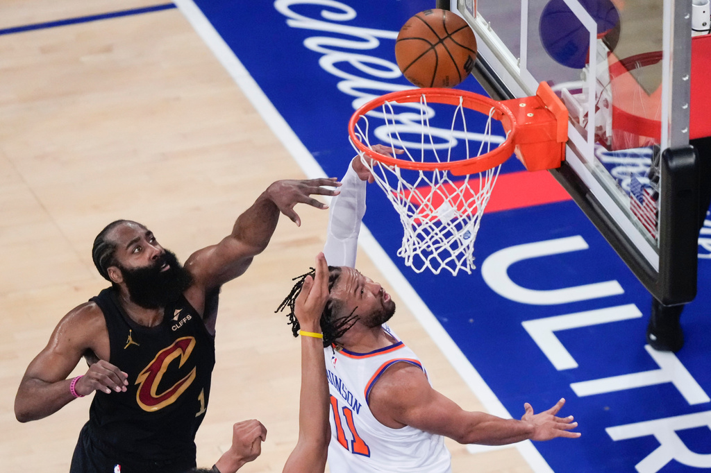 New York Knicks guard Jalen Brunson (11) shoots past Cleveland Cavaliers guard James Harden (1) during the first half of Game 1 in the Eastern Conference finals NBA basketball playoffs series, Tuesday, May 19, 2026, in New York. (AP Photo/Yuki Iwamura)