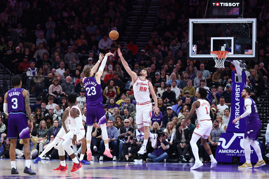 Utah Jazz forward Lauri Markkanen (23) shoots over Houston Rockets center Alperen Sengun (28) during the second half of an NBA basketball game Monday, Dec. 1, 2025, in Salt Lake City. (AP Photo/Rob Gray)