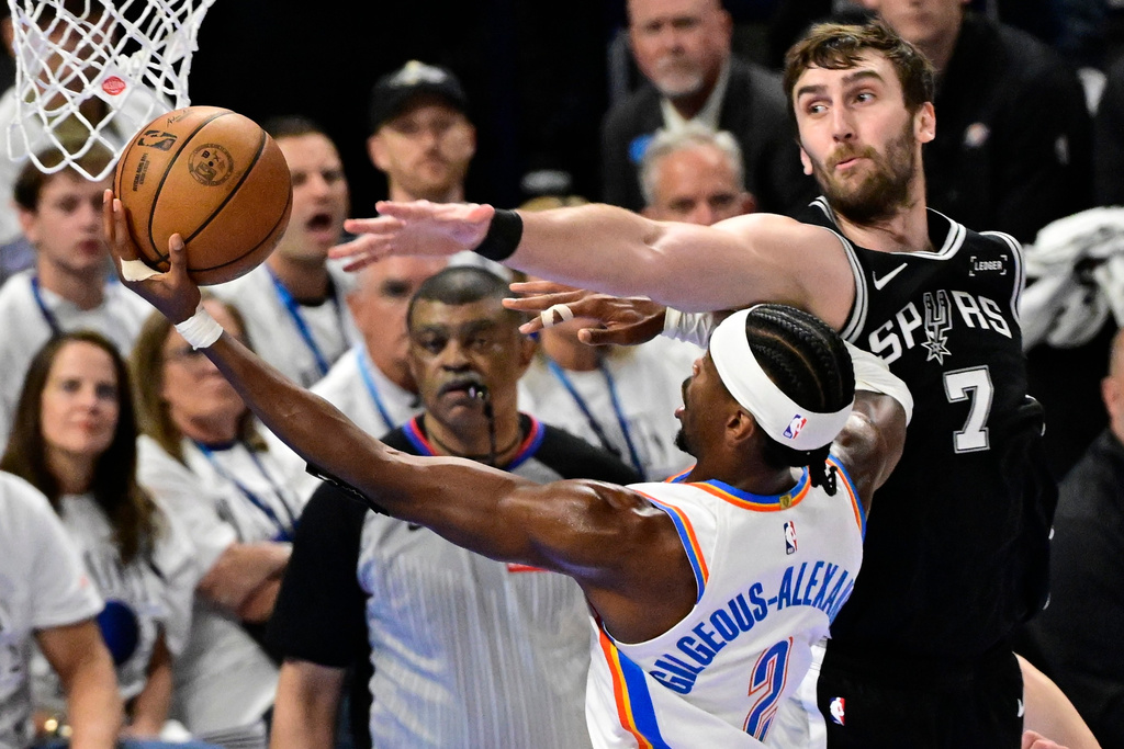 Oklahoma City Thunder guard Shai Gilgeous-Alexander (2) goes to the basket aginst San Antonio Spurs center Luke Kornet (7) in the second half of Game 5 in the Western Conference finals NBA basketball playoffs series, Tuesday, May 26, 2026, in Oklahoma City. (AP Photo/Gerald Leong)
