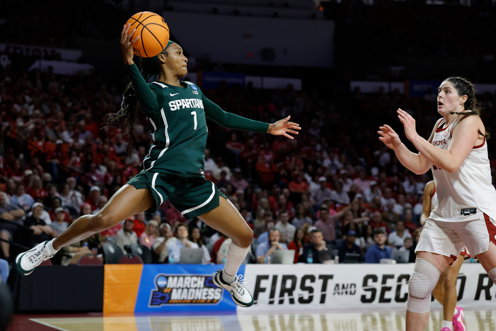 Michigan State guard Rashunda Jones (1) saves the ball from going out of bounds against Oklahoma during the first half in the second round of the NCAA college basketball tournament, Sunday, March 22, 2026, Norman, Okla. (AP Photo/Alonzo Adams)