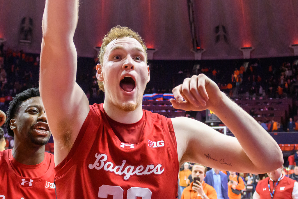 Wisconsin's Austin Rapp celebrates an overtime win over Illinois during an NCAA college basketball game Tuesday, Feb. 10, 2026, in Champaign, Ill. (AP Photo/Craig Pessman)