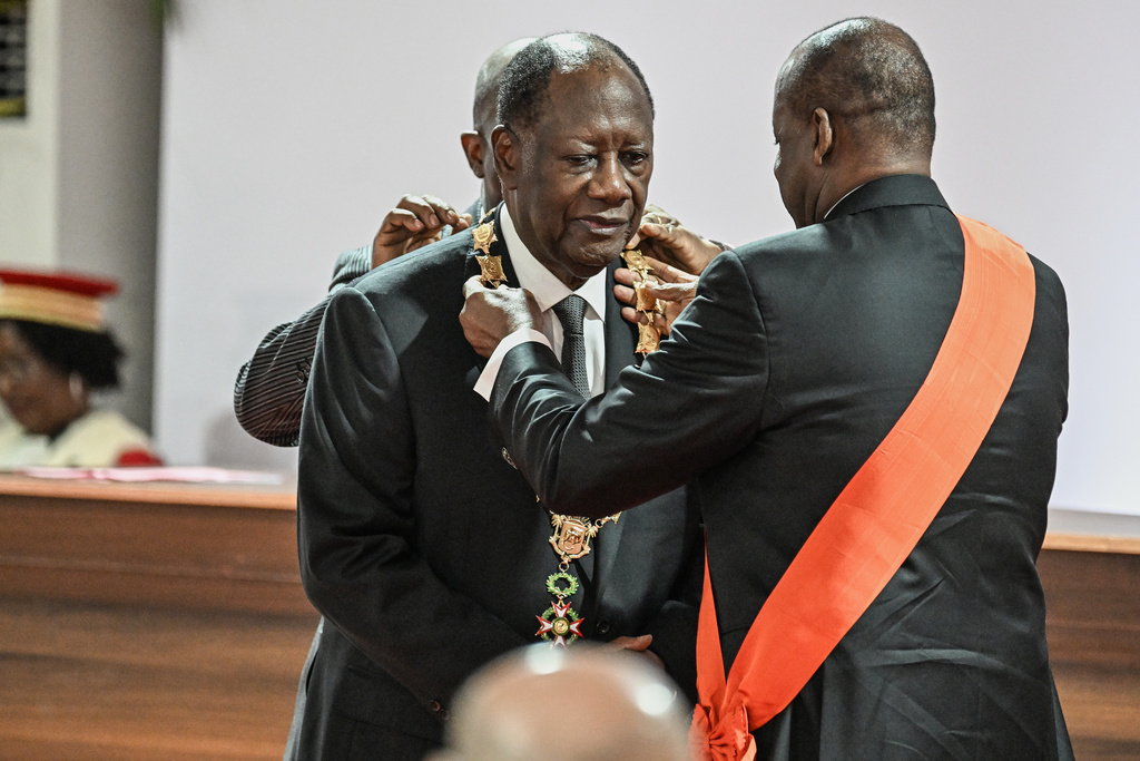 Ivory Coast President Alassane Ouattara is inaugurated at the Presidential Palace in Abidjan, Ivory Coast, Monday, Dec. 8, 2025. (Sia Kambou/Pool Photo via AP)