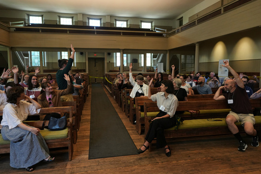 Quakers raise their hands after a worship service at the historic West Room of the Arch Street Meeting House in Philadelphia on Oct. 5, 2025. (AP Photo/Luis Andres Henao) Quakers raise their hands after a worship service at the historic West Room of the Arch Street Meeting House in Philadelphia on Oct. 5, 2025. (AP Photo/Luis Andres Henao)